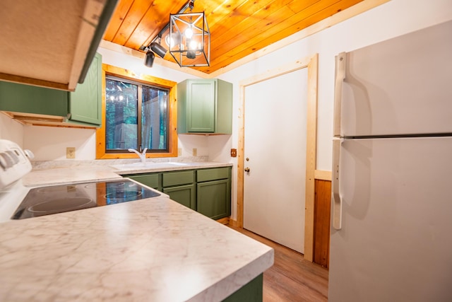 17341 Old Logging Rd, Hersey, MI 49639 - kitchen with freestanding refrigerator, green cabinetry, electric range, wooden ceiling, and light countertops