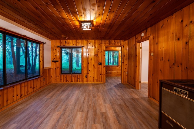17341 Old Logging Rd, Hersey, MI 49639 - empty room with wood walls, wood ceiling, and wood finished floors