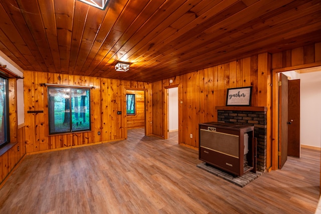 17341 Old Logging Rd, Hersey, MI 49639 - unfurnished living room with wood ceiling, wood finished floors, wooden walls, and baseboards