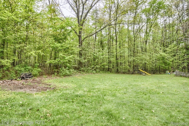 12445 Shaffer Rd, Davisburg, MI 48350 - view of grassy yard with a view of trees
