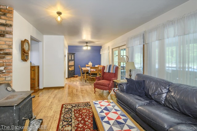 12445 Shaffer Rd, Davisburg, MI 48350 - living area with a wood stove and light wood-style floors