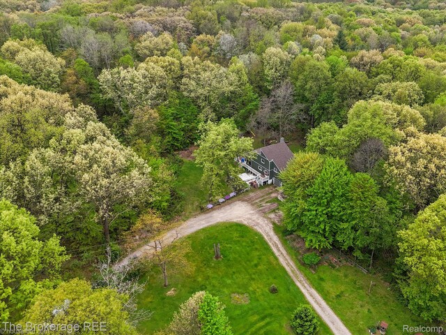 12445 Shaffer Rd, Davisburg, MI 48350 - view of subject property with a heavily wooded area