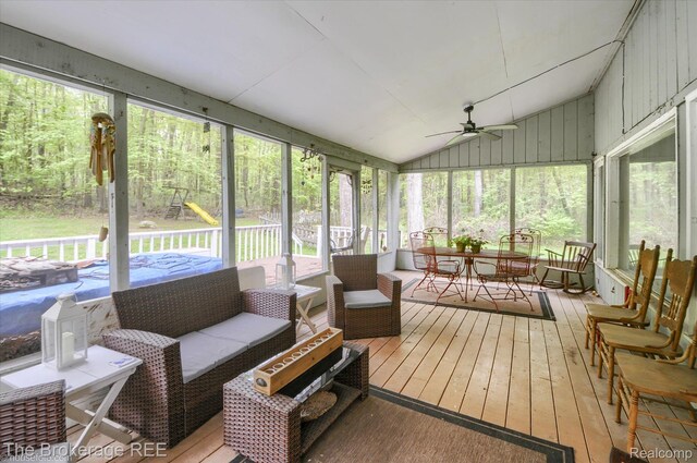 12445 Shaffer Rd, Davisburg, MI 48350 - sunroom / solarium featuring a ceiling fan, outdoor dining space, healthy amount of natural light, and vaulted ceiling