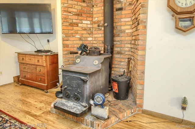 12445 Shaffer Rd, Davisburg, MI 48350 - detailed view of a wood stove and wood finished floors