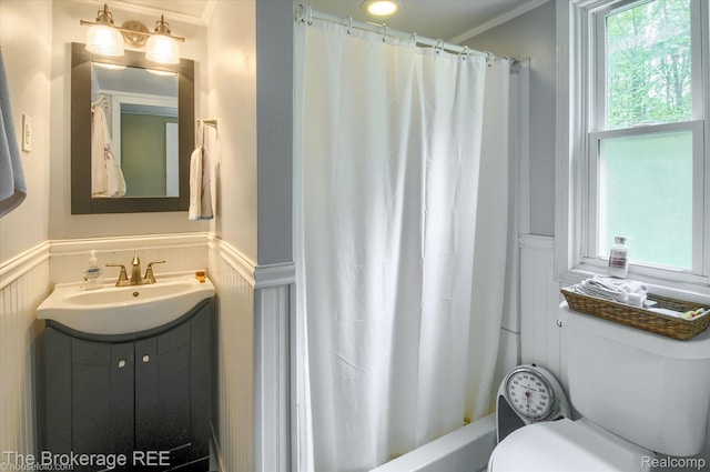 12445 Shaffer Rd, Davisburg, MI 48350 - full bath with toilet, wainscoting, a decorative wall, vanity, and crown molding