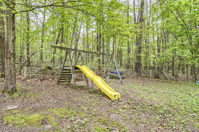 12445 Shaffer Rd, Davisburg, MI 48350 - view of play area with a view of trees