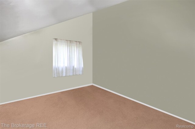 12445 Shaffer Rd, Davisburg, MI 48350 - bonus room featuring vaulted ceiling, carpet, and baseboards