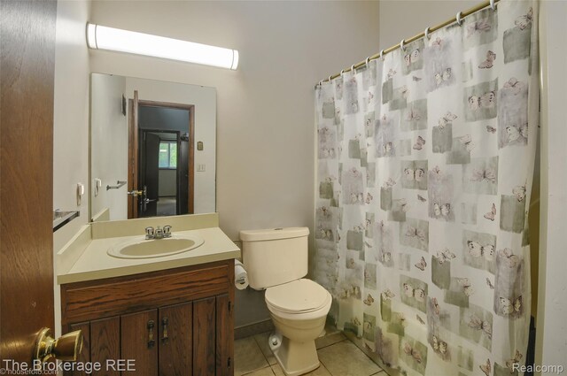 12445 Shaffer Rd, Davisburg, MI 48350 - full bathroom featuring toilet, tile patterned flooring, vanity, and a shower with shower curtain