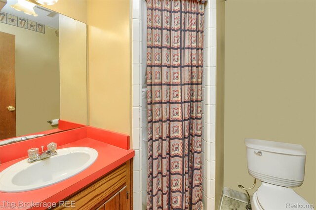 12445 Shaffer Rd, Davisburg, MI 48350 - full bath with vanity, toilet, curtained shower, and tile patterned flooring