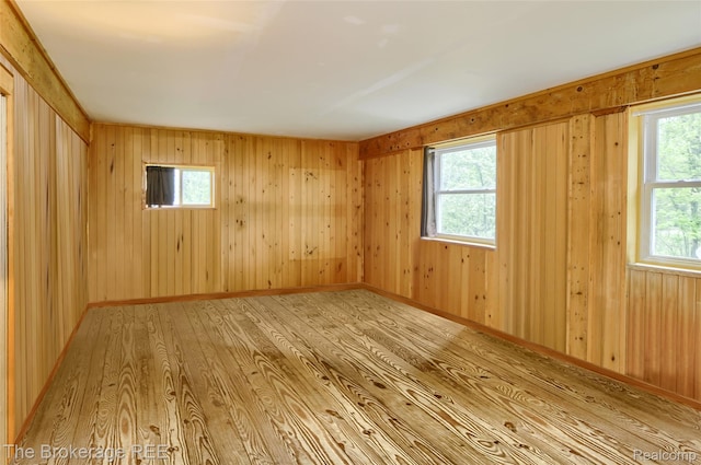 12445 Shaffer Rd, Davisburg, MI 48350 - spare room featuring wood finished floors and wood walls
