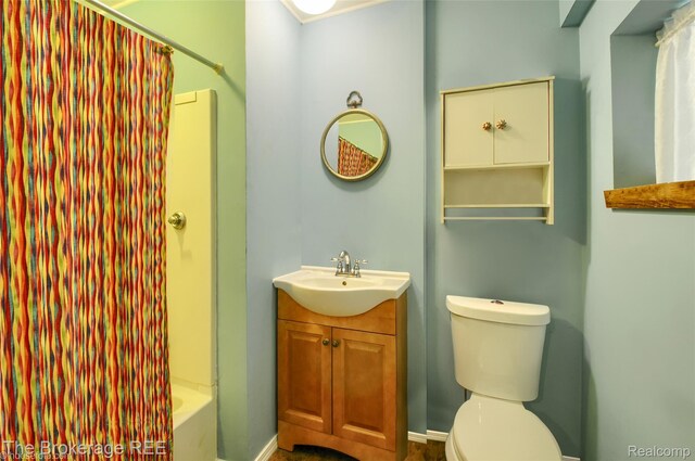 12445 Shaffer Rd, Davisburg, MI 48350 - bathroom featuring vanity, toilet, and shower / tub combo with curtain