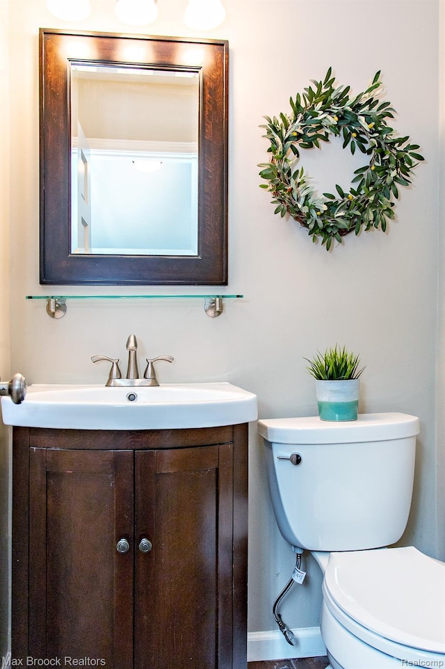 13317 Victoria Ave, Huntington Woods, MI 48070 - bathroom with toilet, vanity, and baseboards