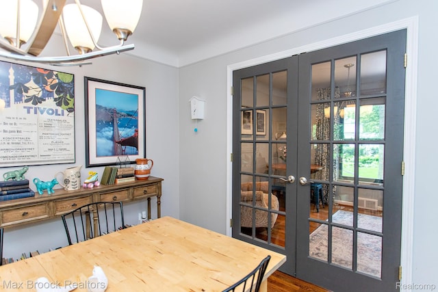 13317 Victoria Ave, Huntington Woods, MI 48070 - dining space featuring french doors and a chandelier