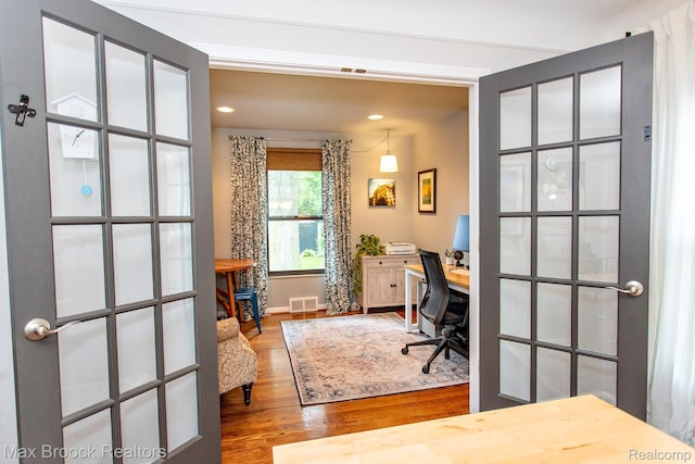 13317 Victoria Ave, Huntington Woods, MI 48070 - home office featuring wood finished floors, recessed lighting, baseboards, and french doors