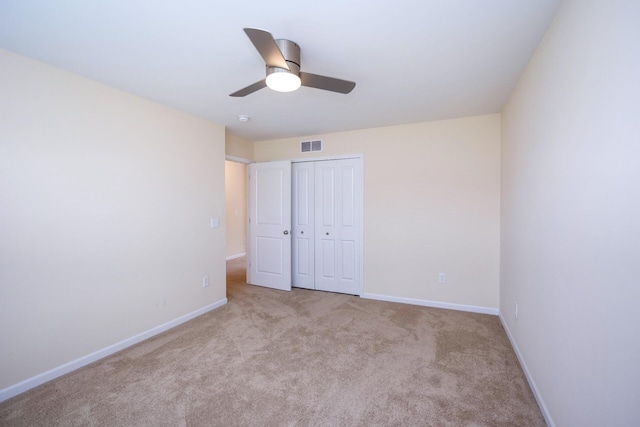 4301 Rolling Meadow Ln, Ypsilanti, MI 48197 - unfurnished bedroom featuring baseboards, carpet, a closet, and a ceiling fan