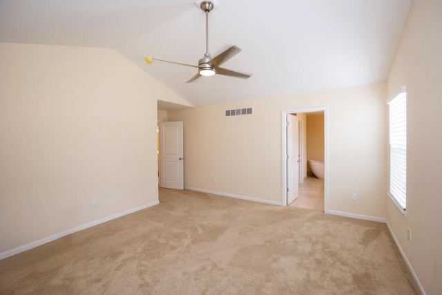 4301 Rolling Meadow Ln, Ypsilanti, MI 48197 - unfurnished bedroom featuring vaulted ceiling, light colored carpet, ensuite bath, and baseboards