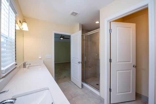 4301 Rolling Meadow Ln, Ypsilanti, MI 48197 - bathroom with double vanity, a shower stall, a ceiling fan, and tile patterned floors