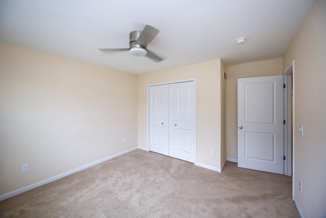 4301 Rolling Meadow Ln, Ypsilanti, MI 48197 - unfurnished bedroom featuring carpet, a closet, baseboards, and ceiling fan