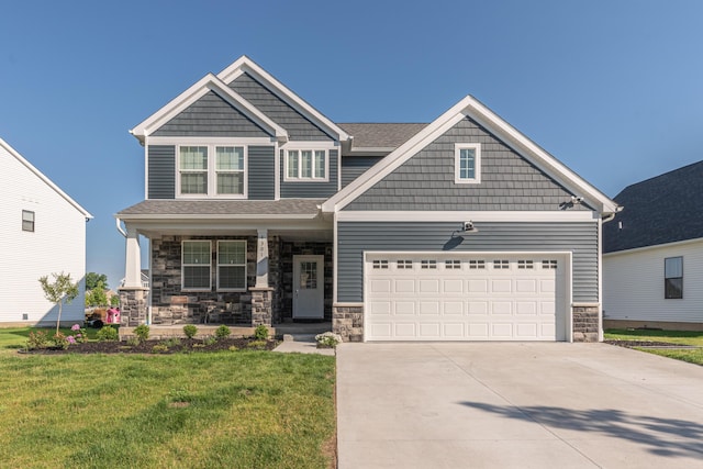 4301 Rolling Meadow Ln, Ypsilanti, MI 48197 - craftsman-style house with a porch, driveway, stone siding, a front yard, and a garage