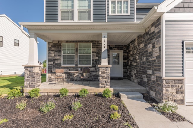 4301 Rolling Meadow Ln, Ypsilanti, MI 48197 - entrance to property featuring covered porch and stone siding
