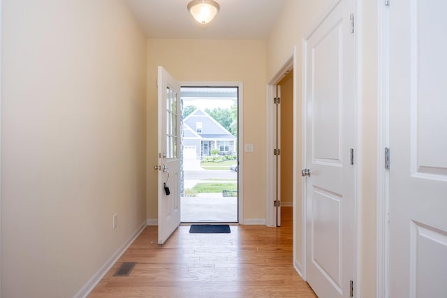 4301 Rolling Meadow Ln, Ypsilanti, MI 48197 - doorway featuring light wood-style floors and baseboards