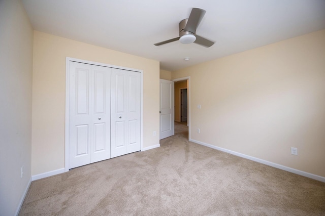 4301 Rolling Meadow Ln, Ypsilanti, MI 48197 - unfurnished bedroom featuring carpet, a closet, baseboards, and a ceiling fan