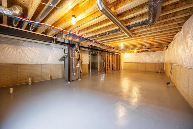 4301 Rolling Meadow Ln, Ypsilanti, MI 48197 - unfinished below grade area with heating unit and brick wall