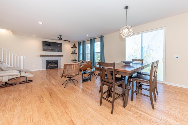 4301 Rolling Meadow Ln, Ypsilanti, MI 48197 - dining space with light wood-style flooring, a tiled fireplace, baseboards, and recessed lighting