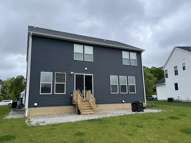 4301 Rolling Meadow Ln, Ypsilanti, MI 48197 - rear view of property with a yard and central AC unit