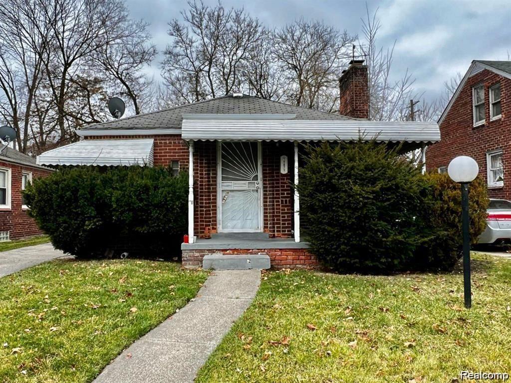 18071 Saint Marys St, Detroit, MI 48235 - bungalow-style home with a front lawn, a chimney, brick siding, and roof with shingles