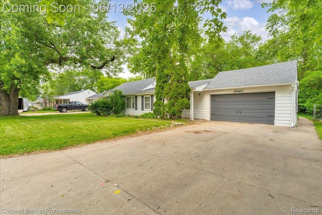 9060 N Sheldon Rd, Plymouth, MI 48170 - ranch-style home featuring an attached garage, driveway, and a front lawn
