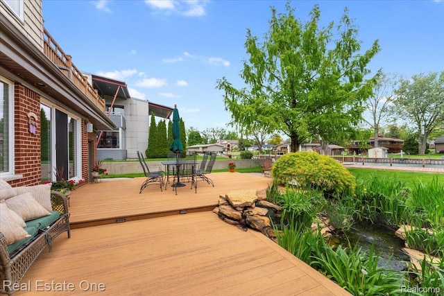 28395 Swan Island Dr, Grosse Ile, MI 48138 - wooden deck with outdoor dining space