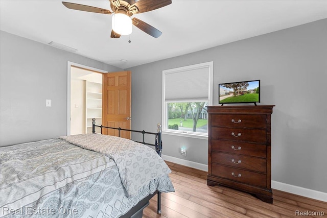 28395 Swan Island Dr, Grosse Ile, MI 48138 - bedroom with wood finished floors, baseboards, and ceiling fan