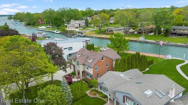 28395 Swan Island Dr, Grosse Ile, MI 48138 - aerial perspective of suburban area with a large body of water