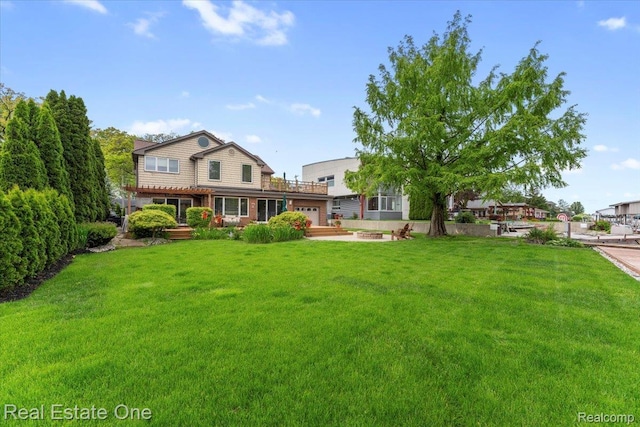 28395 Swan Island Dr, Grosse Ile, MI 48138 - view of green lawn with an attached garage