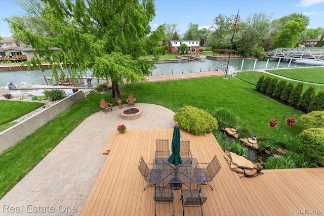 28395 Swan Island Dr, Grosse Ile, MI 48138 - view of grassy yard with a water view and an outdoor fire pit
