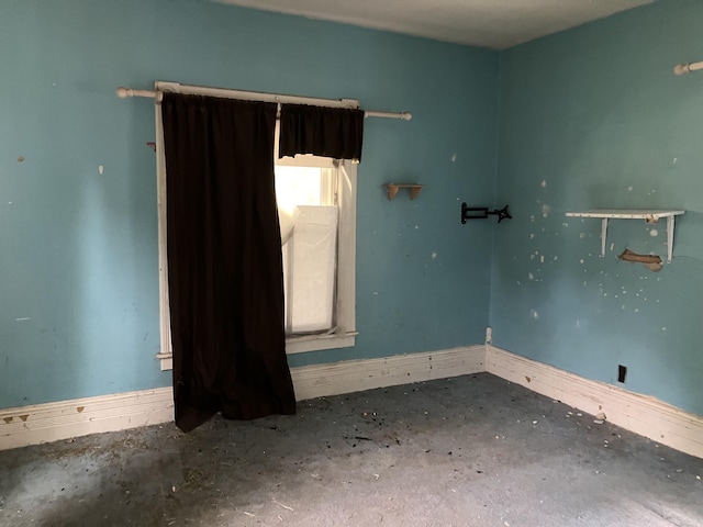 821 Fletcher St, Owosso, MI 48867 - unfurnished room featuring concrete flooring and baseboards
