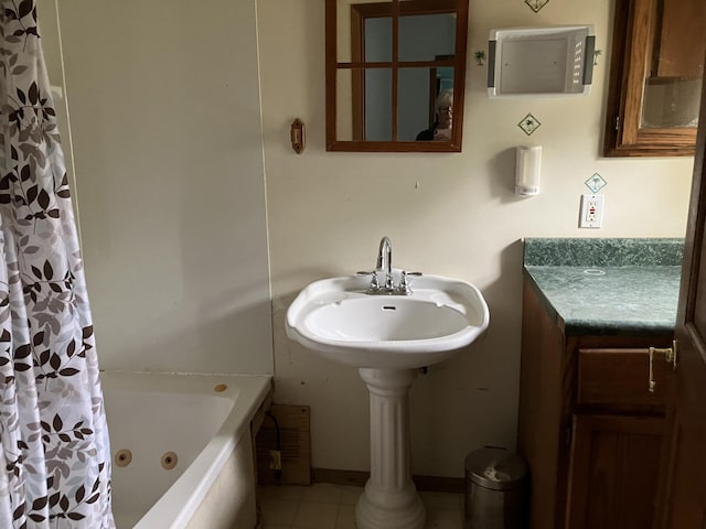821 Fletcher St, Owosso, MI 48867 - full bath with tile patterned flooring, a combined bath / shower with jetted tub, and electric panel