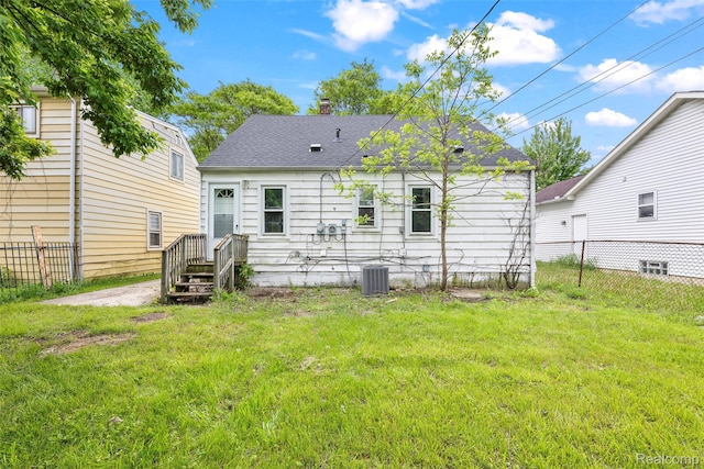 29056 Powers St, Westland, MI 48186 - back of house featuring cooling unit, roof with shingles, and a chimney