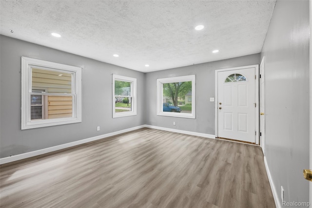 29056 Powers St, Westland, MI 48186 - foyer entrance featuring a textured ceiling, wood finished floors, recessed lighting, and baseboards