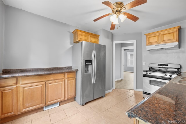 29056 Powers St, Westland, MI 48186 - kitchen with appliances with stainless steel finishes, under cabinet range hood, a ceiling fan, light tile patterned floors, and baseboards