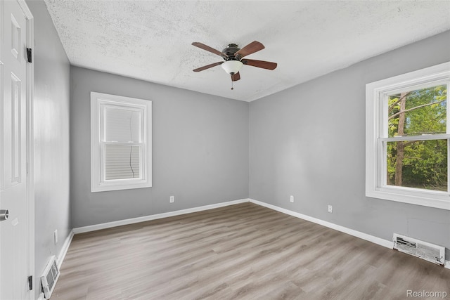 29056 Powers St, Westland, MI 48186 - empty room featuring ceiling fan, wood finished floors, baseboards, and a textured ceiling