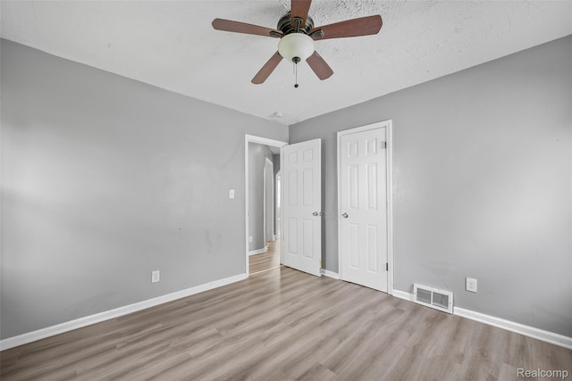 29056 Powers St, Westland, MI 48186 - unfurnished bedroom featuring wood finished floors, baseboards, a closet, and ceiling fan