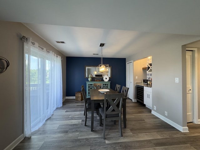 1300 Winding Ridge Ln Unit D8, Indiana, IN 46383 - dining area with beverage cooler, dark wood-style flooring, and baseboards