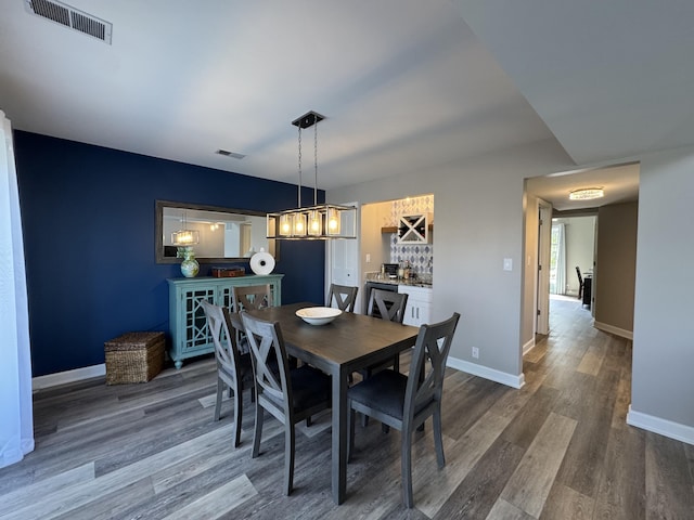 1300 Winding Ridge Ln Unit D8, Indiana, IN 46383 - dining space with dark wood-style floors and baseboards