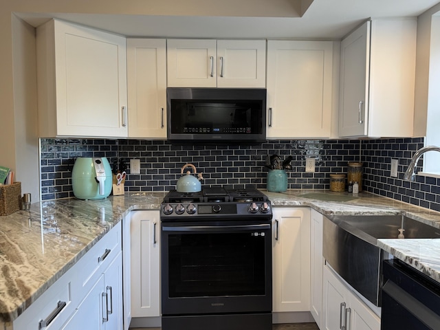 1300 Winding Ridge Ln Unit D8, Indiana, IN 46383 - kitchen featuring gas range, dishwasher, a sink, and white cabinets