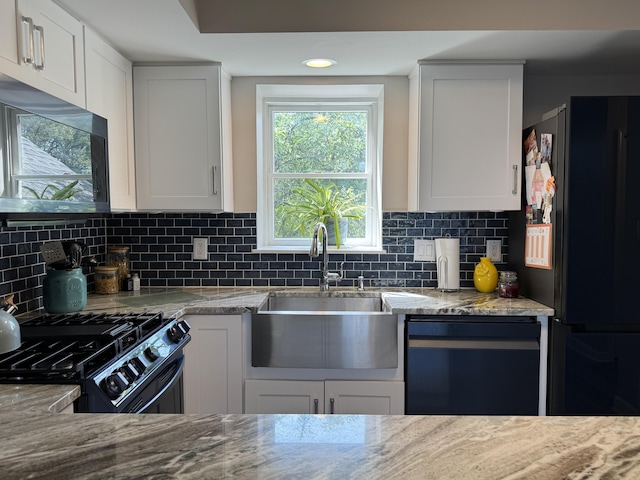 1300 Winding Ridge Ln Unit D8, Indiana, IN 46383 - kitchen with a sink, black appliances, backsplash, light stone counters, and white cabinetry