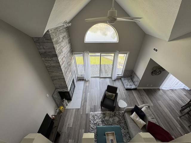 1300 Winding Ridge Ln Unit D8, Indiana, IN 46383 - living room featuring high vaulted ceiling, a ceiling fan, a textured ceiling, and wood finished floors