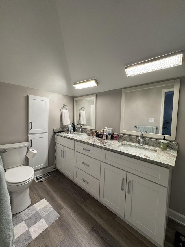 1300 Winding Ridge Ln Unit D8, Indiana, IN 46383 - full bath with wood finished floors, double vanity, toilet, and baseboards