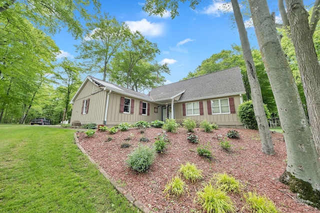 8750 20th Ave, Remus, MI 49340 - single story home featuring board and batten siding, a front lawn, and a shingled roof